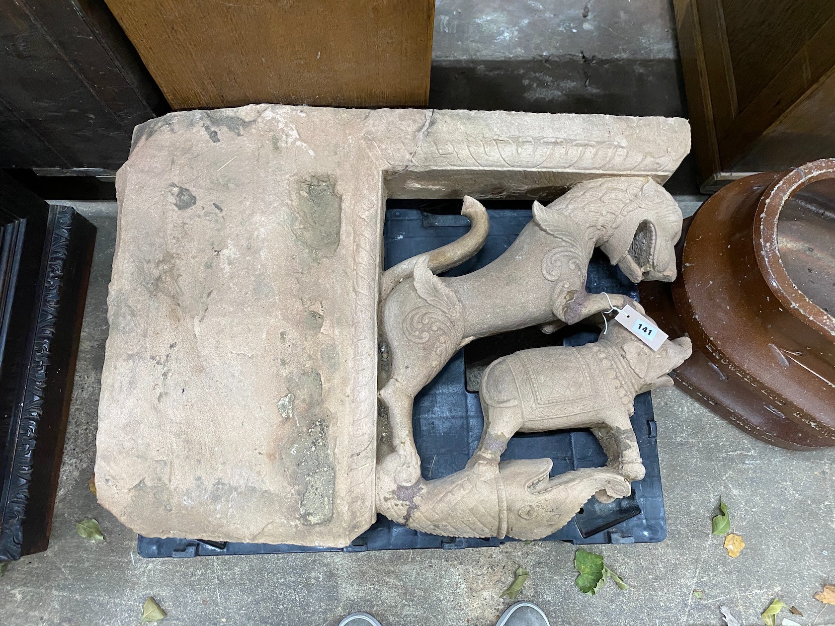 An Eastern carved stone relief, width 80cm, height 61cm